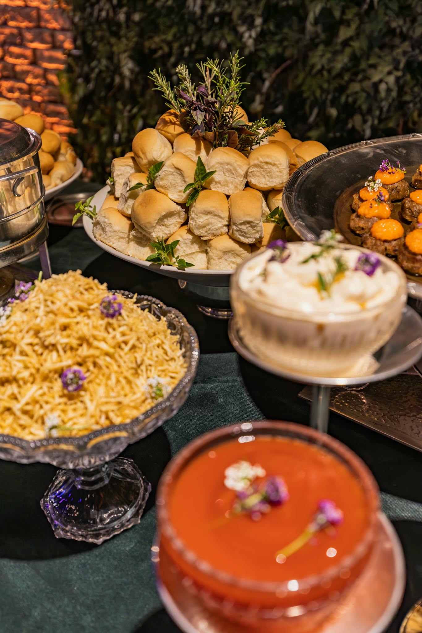 A beautifully arranged banquet table displaying a variety of elegant dishes ready for a celebration.